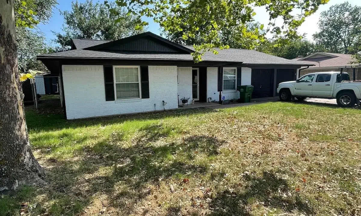 Professional roofing crew working on a residential roof in Cobleskill